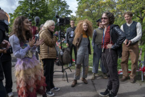 Behind the scenes picture of Rachel Zegler (Lucy Gray Baird), Luna Steeples (Dill), Cooper Dillon (Mizzen), Nina Jacobson (Producer) and Lucas Wilson (Panlo) on the set of The Hunger Games : The Ballad of Songbirds and Snakes.